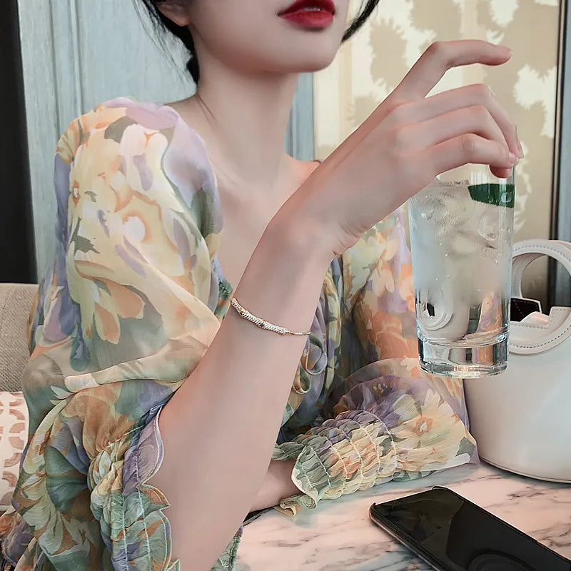 Bracelete Zynelle Gótico Bambu Zirconia Ouro – Mistério Dourado