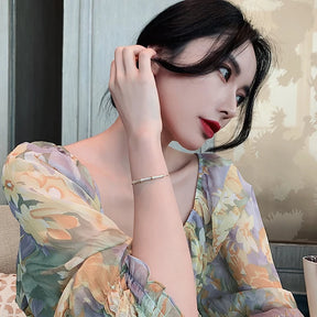 Bracelete Zynelle Gótico Bambu Zirconia Ouro – Mistério Dourado